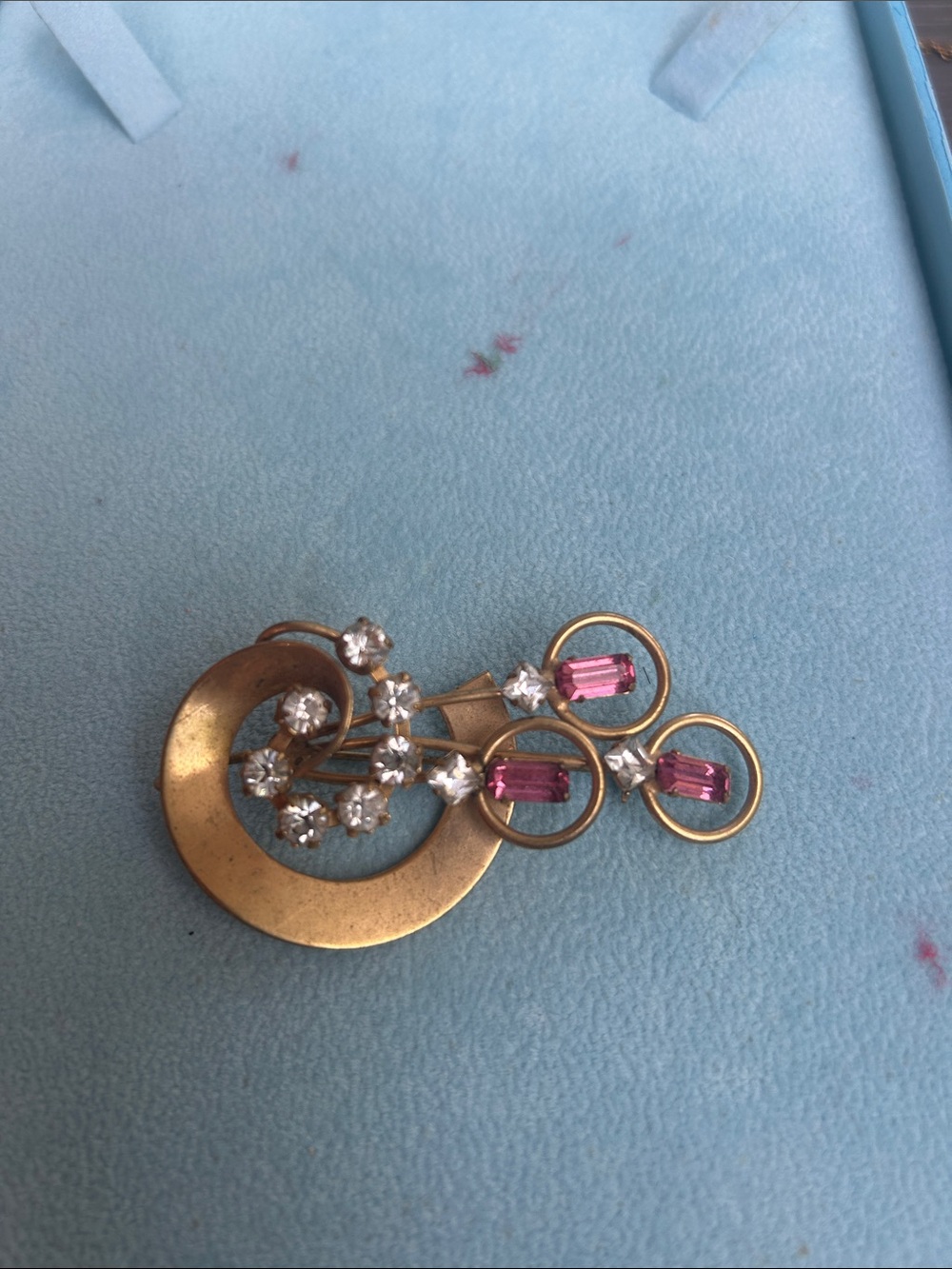 Vintage gold tone brooch with pink and clear rhinestones